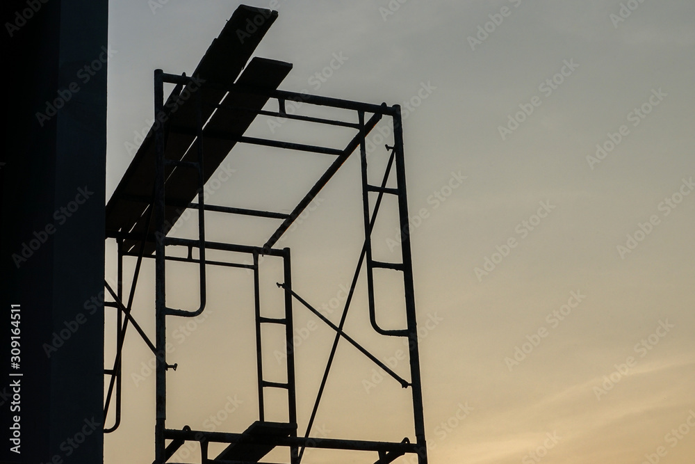 Silhouette steel scaffolding with twilight sky background at the constrcution site Silhouette steel scaffolding with twilight sky background at the constrcution site