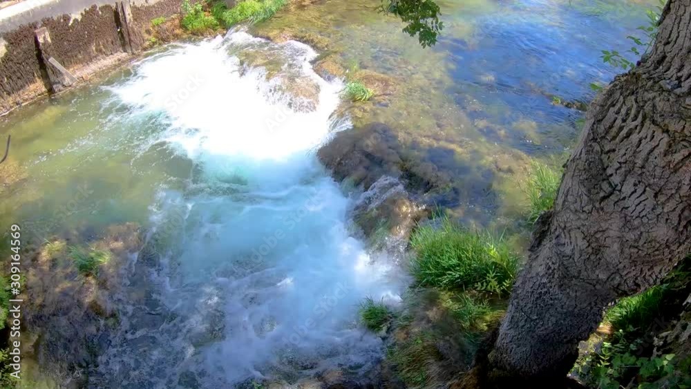 A steady cascading waterfall of this urban river A steady cascading waterfall of this urban river