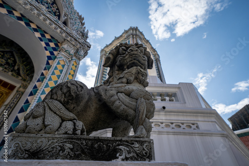 Beautiful guard statue at a temple building at the Grand Palace ancient buddhist temple in Bangkok Thailand photo