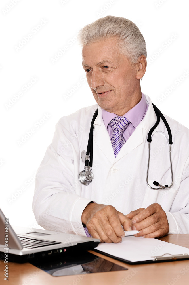 Portrait of elderly doctor with a laptop on white background Portrait of elderly doctor with a laptop on white background