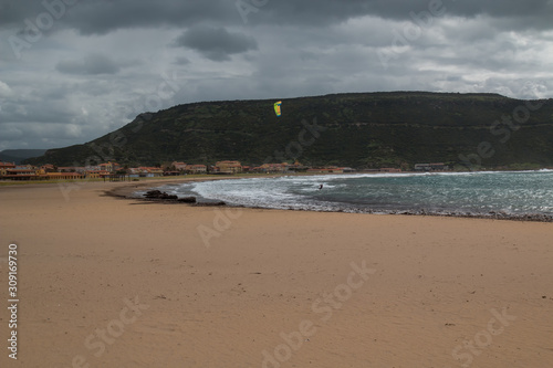 Sandy beach and a mountain  Bosa Marina