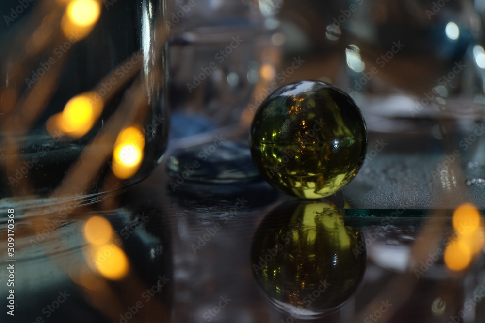 glass ball among the glare, reflections and lights glass ball among the glare, reflections and lights