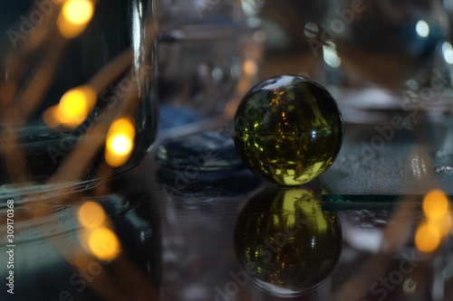 glass ball among the glare, reflections and lights