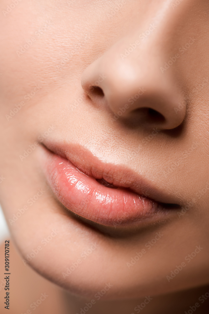 cropped view of girl with shiny lip gloss on lips