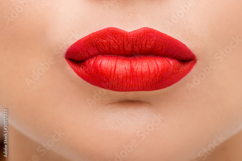 close up of young woman with red lipstick