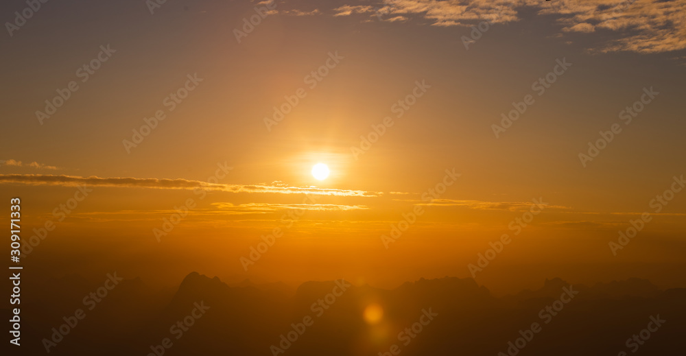 Sunrise landscape with hazy mountain ,clear sky in the morning and light flare.