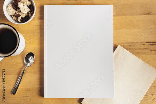 Mockup of cover of catalog, magazines or book. Coffee, spoon and icecream in background.