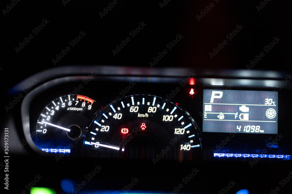 Modern car illuminated dashboard closeup Modern car illuminated dashboard closeup