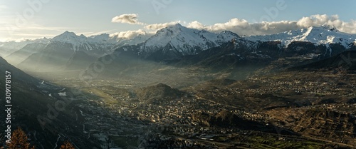 Sunset over the Sion valley, Autumn in Canton of Valais, Switzerland photo