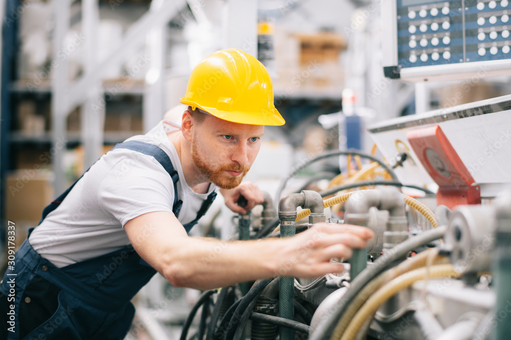 Factory worker. Man with helmet working on wires. Factory worker. Man with helmet working on wires.