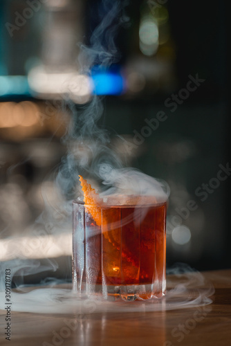 Boulevardie cocktail on a bar desk. Bright background photo