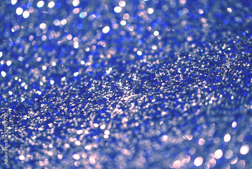 Beutiful festive background, shallow depth of field. Color of the year 2020 concept, classic blue colored trend for your design. Copy space. COY2020. Amazing shining glitter sparkles for cards, design