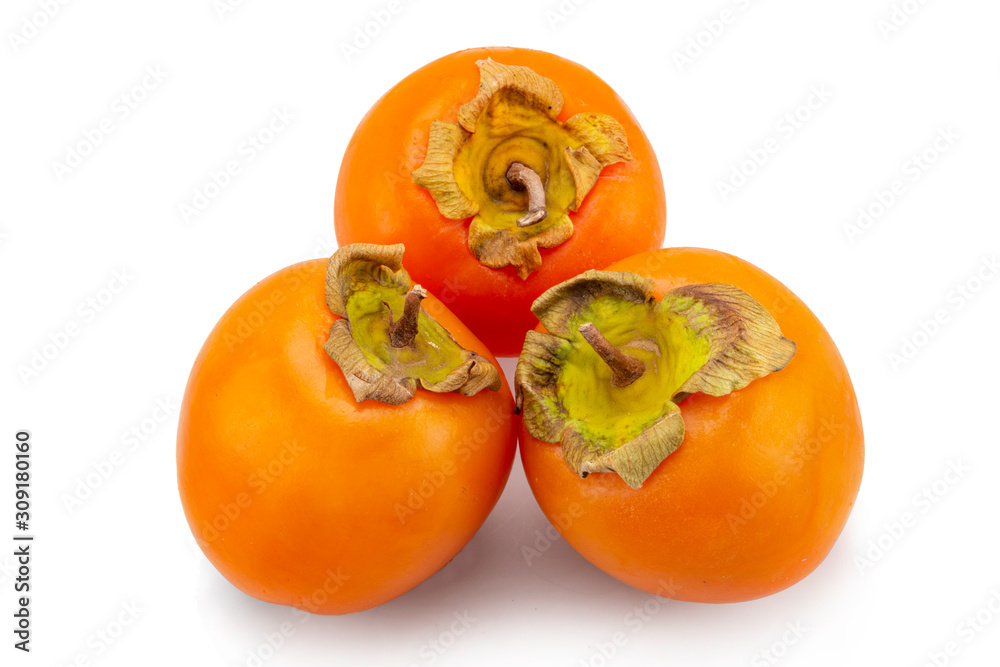 fresh ripe persimmons with leaf isolated on white background. full depth of field fresh ripe persimmons with leaf isolated on white background. full depth of field