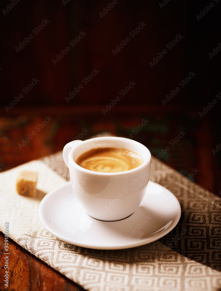 Cup of coffee on dark brown background. Cup of coffee on dark brown background.