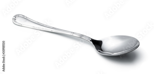 Silver shiny spoon isolated on white background photo