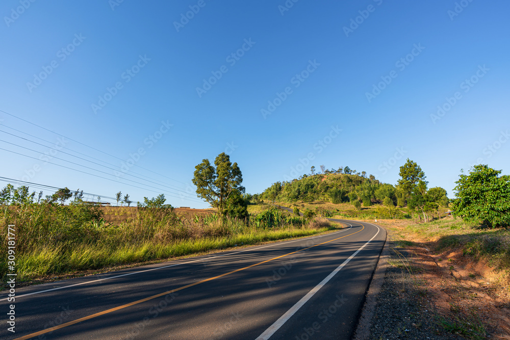 Fototapeta premium beautiful blue sky high peak mountains mist fog wildlife green forest at Khao Koh Phu Tub Berk Phetchabun Thailand guiding idea long weekend for backpacker camping campfire relaxing hiking 