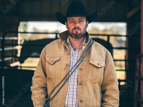 Cowboy horseman with horse in the background