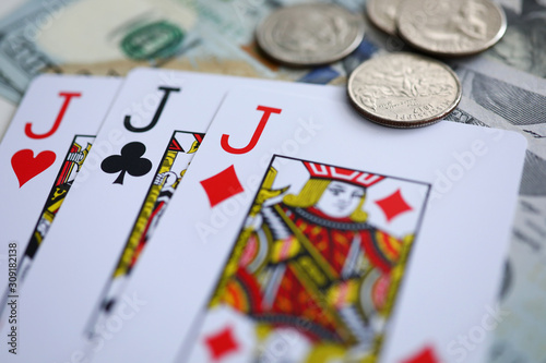 Playing cards lying at money stake with jack combination