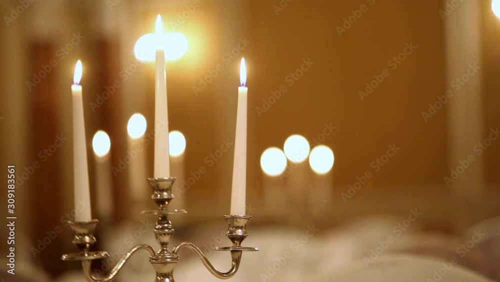 Served table with dishes and candles in a restaurant