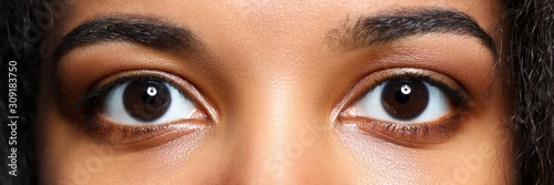 Letterbox view of black woman eyes photo