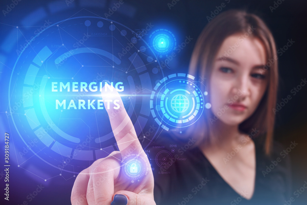 Business, Technology, Internet and network concept. Young businessman working on a virtual screen of the future and sees the inscription: Business, Technology, Internet and network concept. Young businessman working on a virtual screen of the future and sees the inscription: