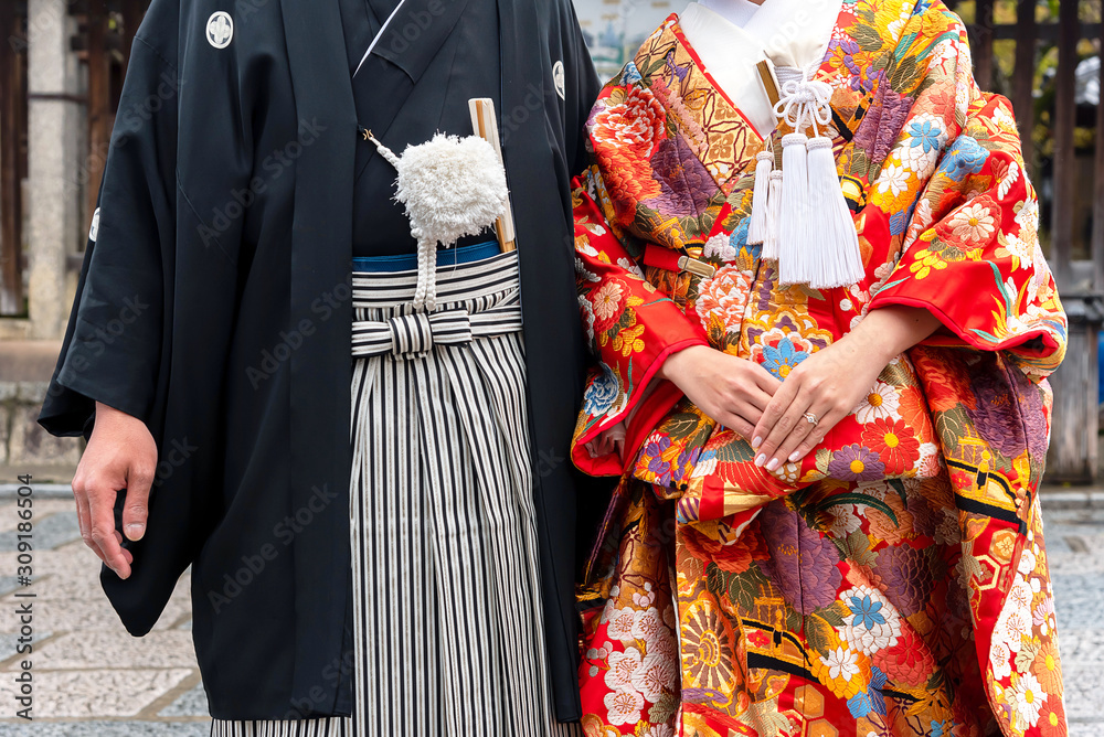 Detail of a japanese couple dressed in traditional costume