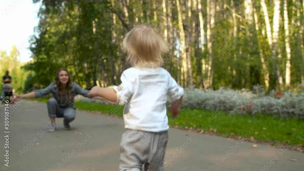 Toddler running to his mom