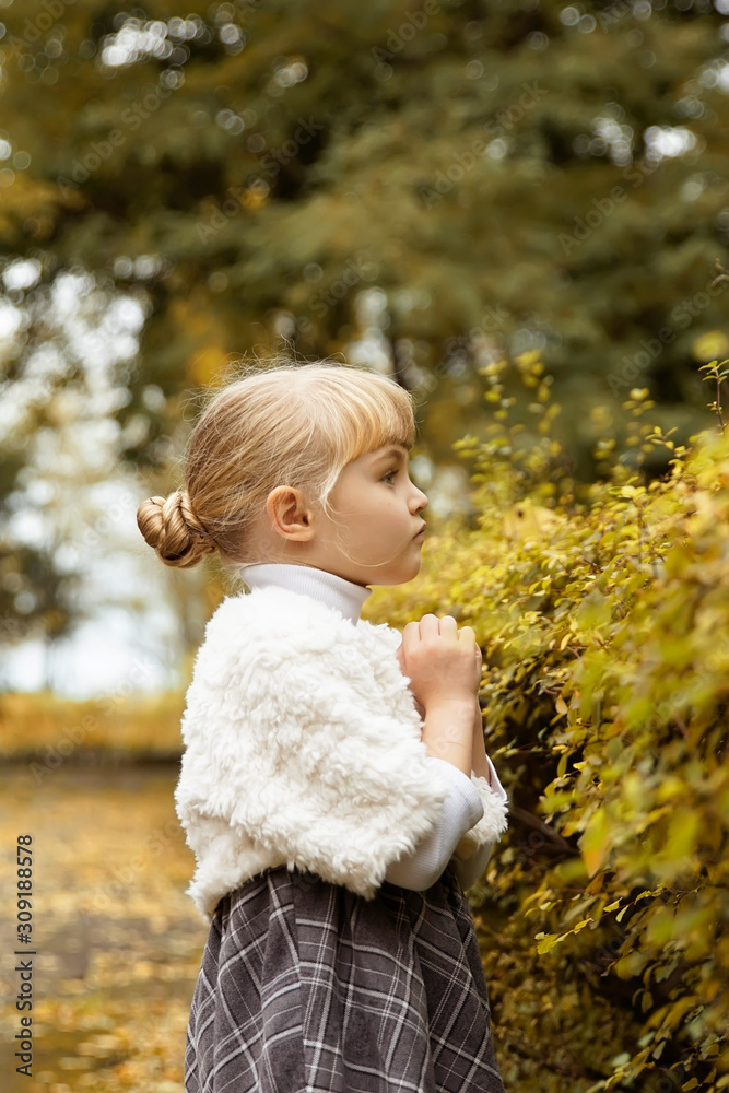 charming girl with blond hair walks in the park and rubs life. retro image charming girl with blond hair walks in the park and rubs life. retro image