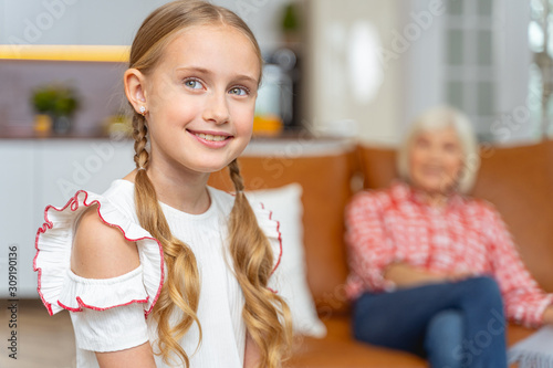 Foto Young lady with pigtails posing for the camera