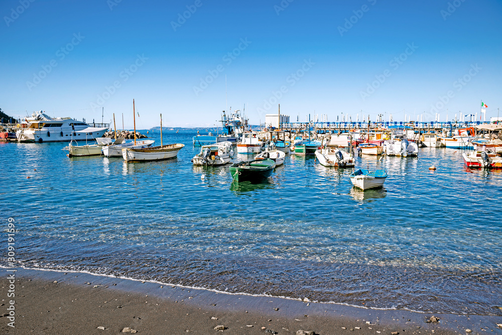 Boats on the black-sanded beach of Sorrento, Italy