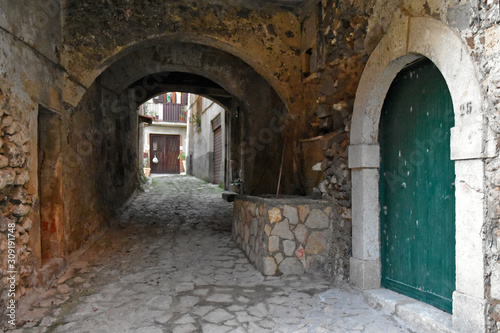 An alley between the old houses of a mountain village in the region Campania  Italy