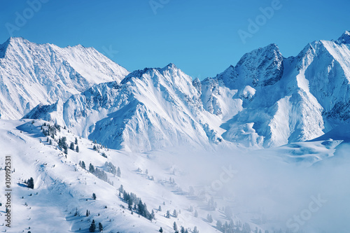 Landscape in Zillertal Arena ski resort in clouds of Austria