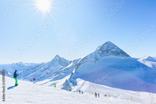 Men Skiers and snowboarders on Hintertux Glacier of Austria