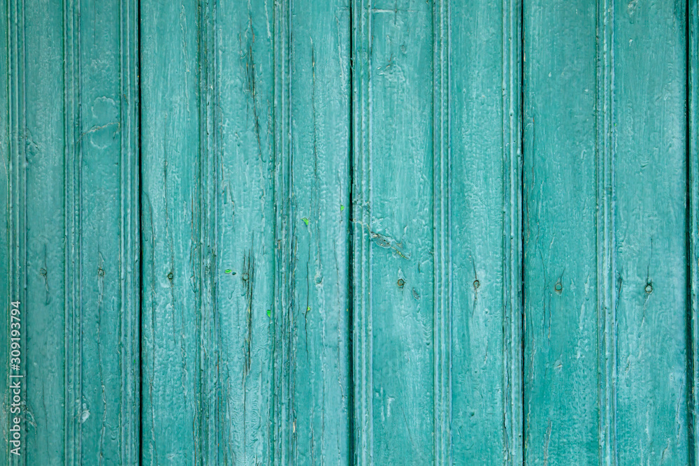 blue-green colored wooden planks wall