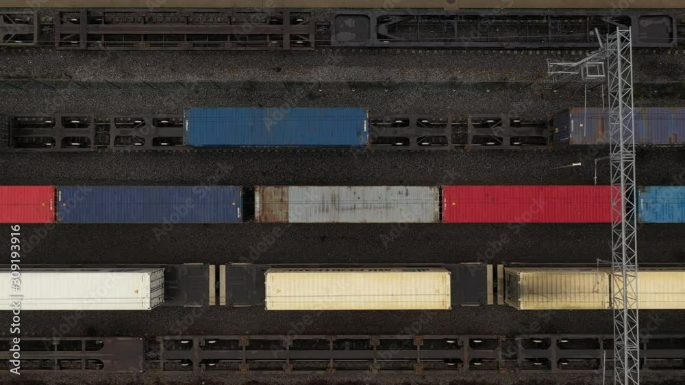 Cargo trains and containers at a terminal. Cargo trains and containers at a terminal.