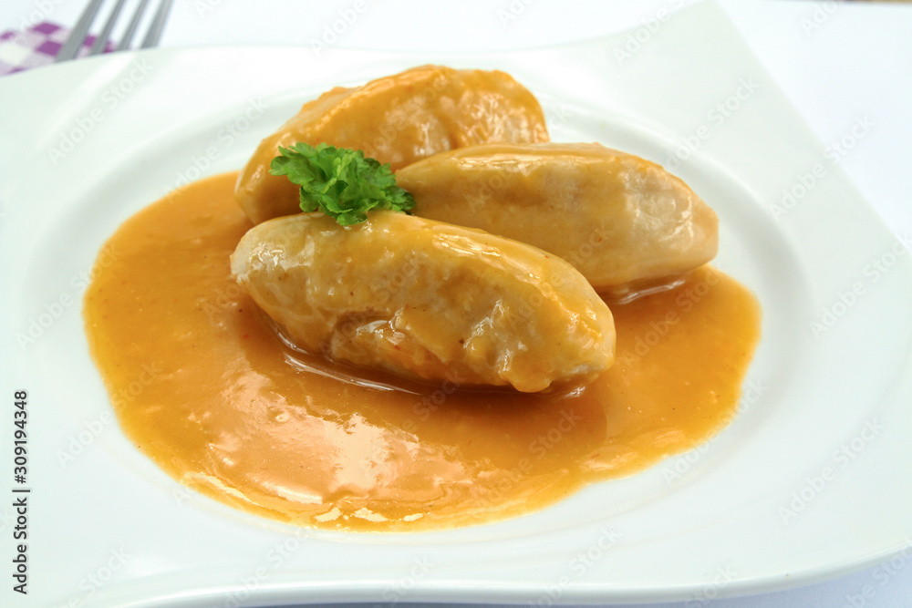 pike dumplings with nantua sauce on a plate foto de Stock | Adobe Stock
