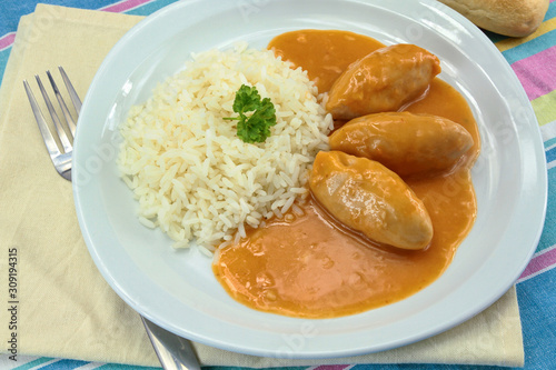 pike dumplings with nantua sauce on a plate photo