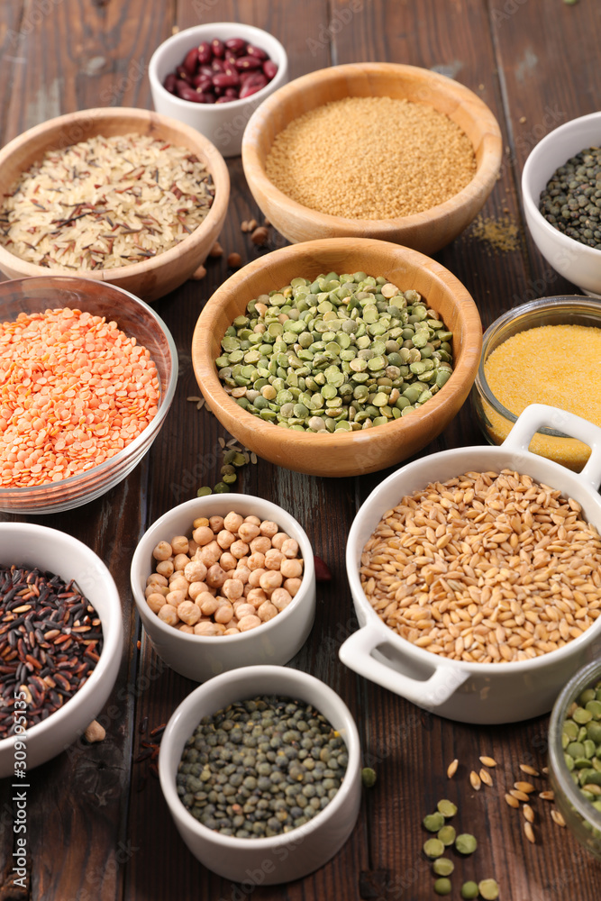 assorted of grain and cereal in bowl- lentils, semolina, chickpea, rice...