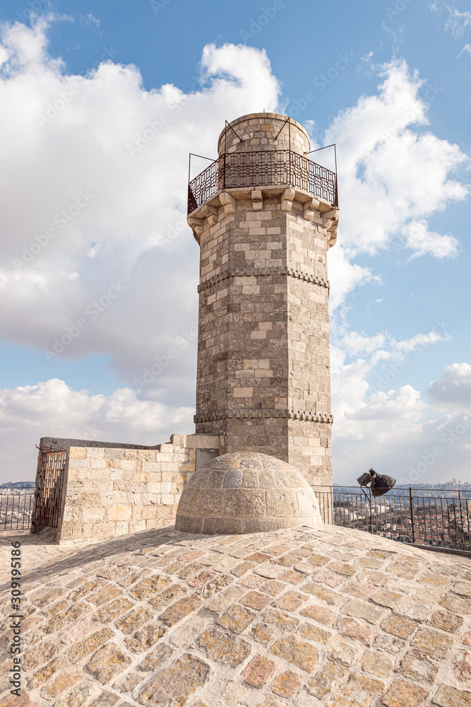 The minaret and the mosque roof of the Muslim part of the grave of the prophet Samuel on Mount of Joy near Jerusalem in Israel