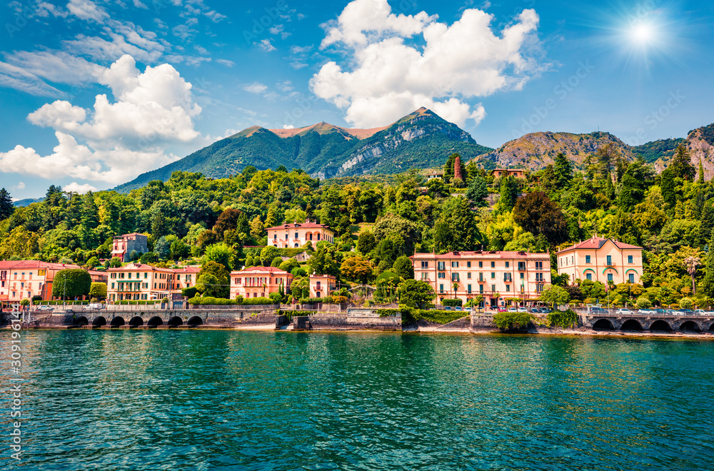 Picturesque summer view from ferry boat of Cadenabbia town. Bright morning scene of Como lake, Italy, Europe. Traveling concept background.