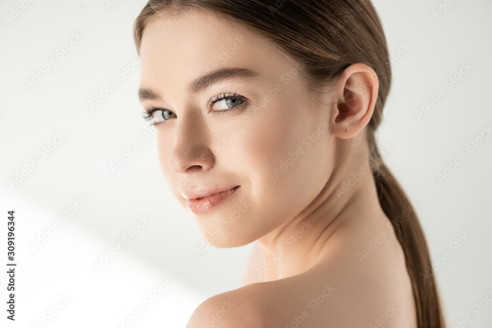 Beautiful naked smiling woman posing on white Beautiful naked smiling woman posing on white