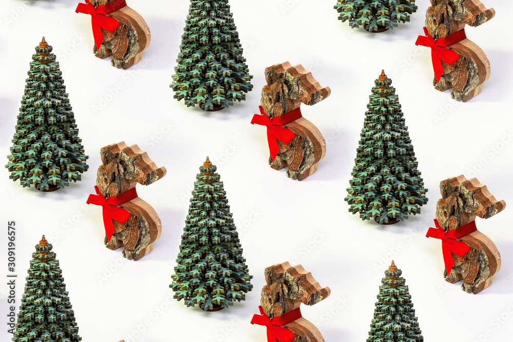 Trendy Xmas pattern made of wooden Christmas tree and deer with red bow on white isometric background in minimal style. Creative concept new Year card. Trendy Xmas pattern made of wooden Christmas tree and deer with red bow on white isometric background in minimal style. Creative concept new Year card.