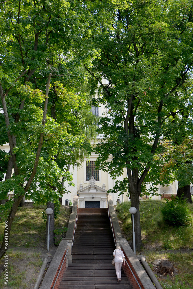 man climbing stairs steps up elderly person on the stairs 