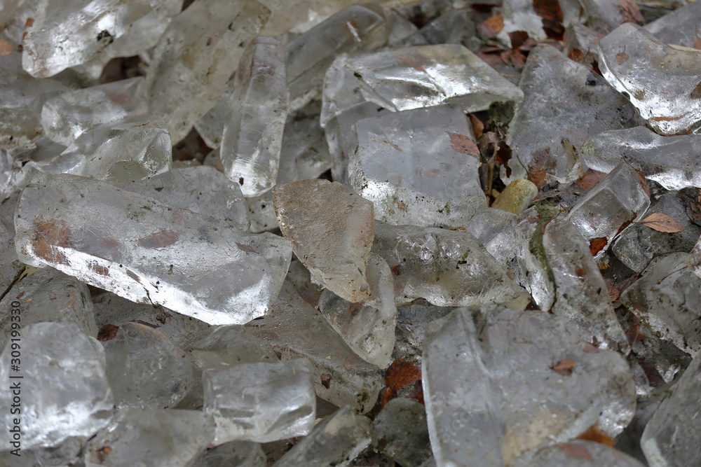 Textured surface of pieces of ice and street dirt Textured surface of pieces of ice and street dirt
