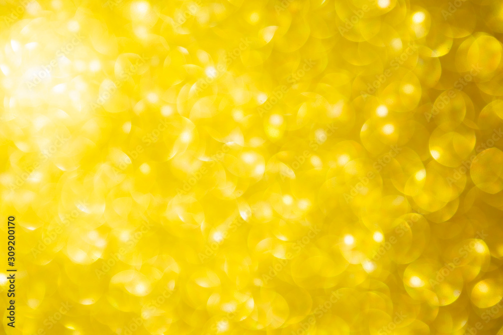 Abstract blurred shiny gold bokeh background, festive and holiday concept background Abstract blurred shiny gold bokeh background, festive and holiday concept background
