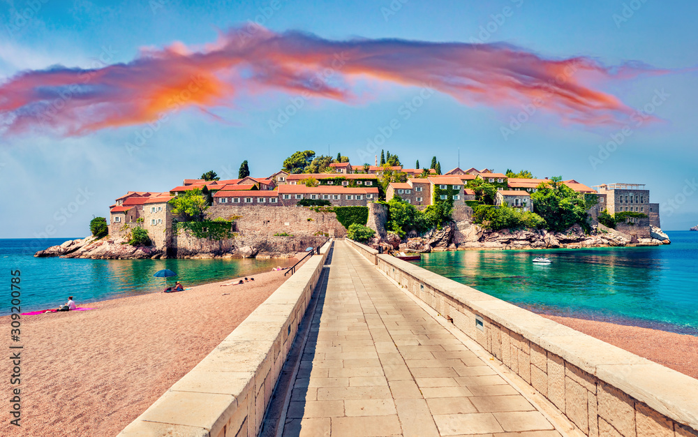 Touristic face of Montenegro - Sveti Stefan, small islet and 5-star hotels resort on the Adriatic coast. Fantastic morning seascape of Adriatic sea, Montenegro, Europe.