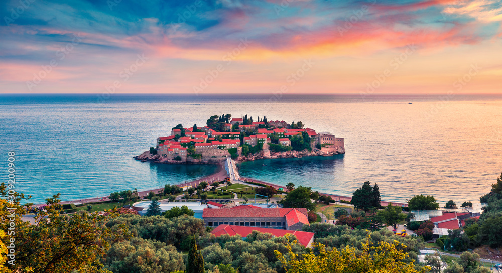 Luxurious resort and popular tourist destination Sveti Stefan town. Amazing sunset seascape of Adriatic sea, Montenegro, Europe. Beautiful world of Mediterranean countries.