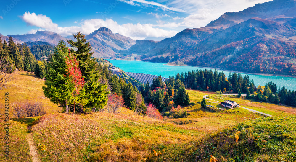 Marvelous morning view of Roselend lake/Lac de Roselend. Colorful autumn scene of Auvergne-Rhone-Alpes, France, Europe. Beauty of nature concept background.