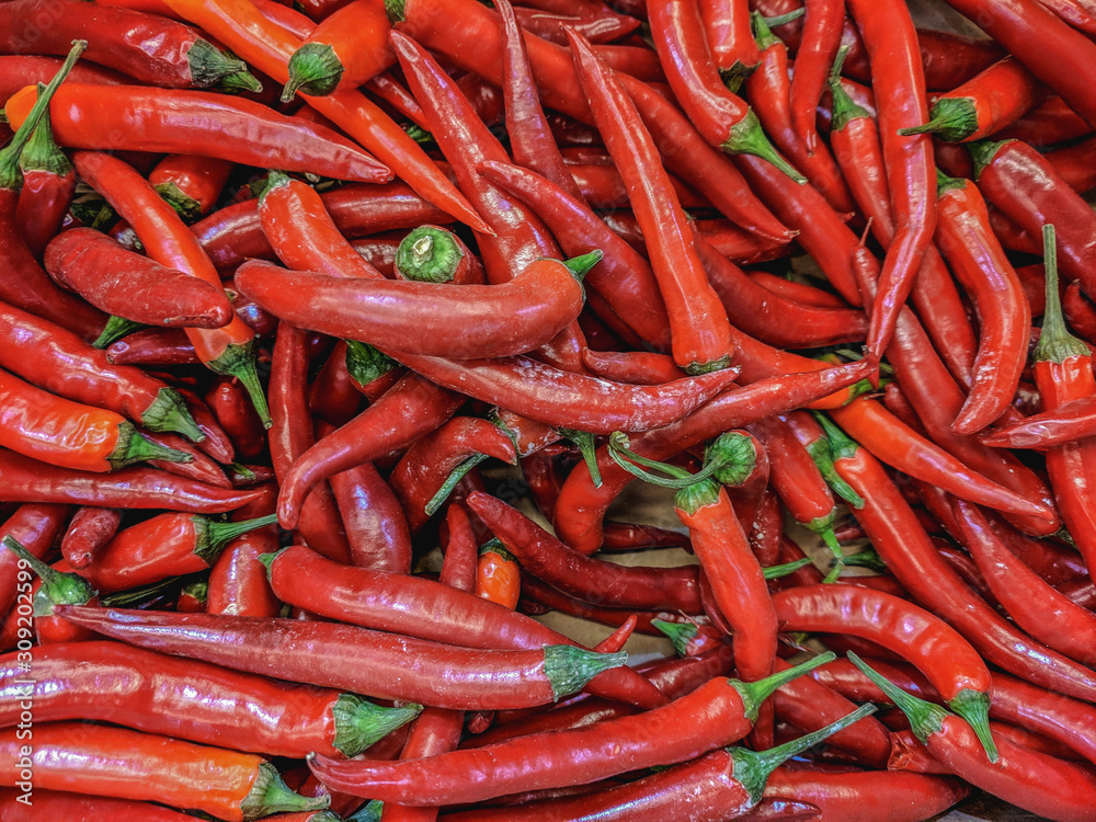  Fresh organic hot chili peppers on a market shelf