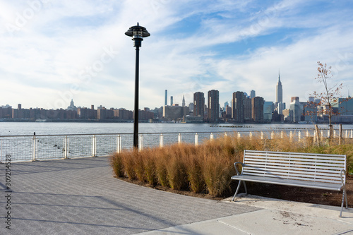 Empty Bench with Plants at a Park in Greenpoint Brooklyn New York looking out towards the East River and the Manhattan Skyline